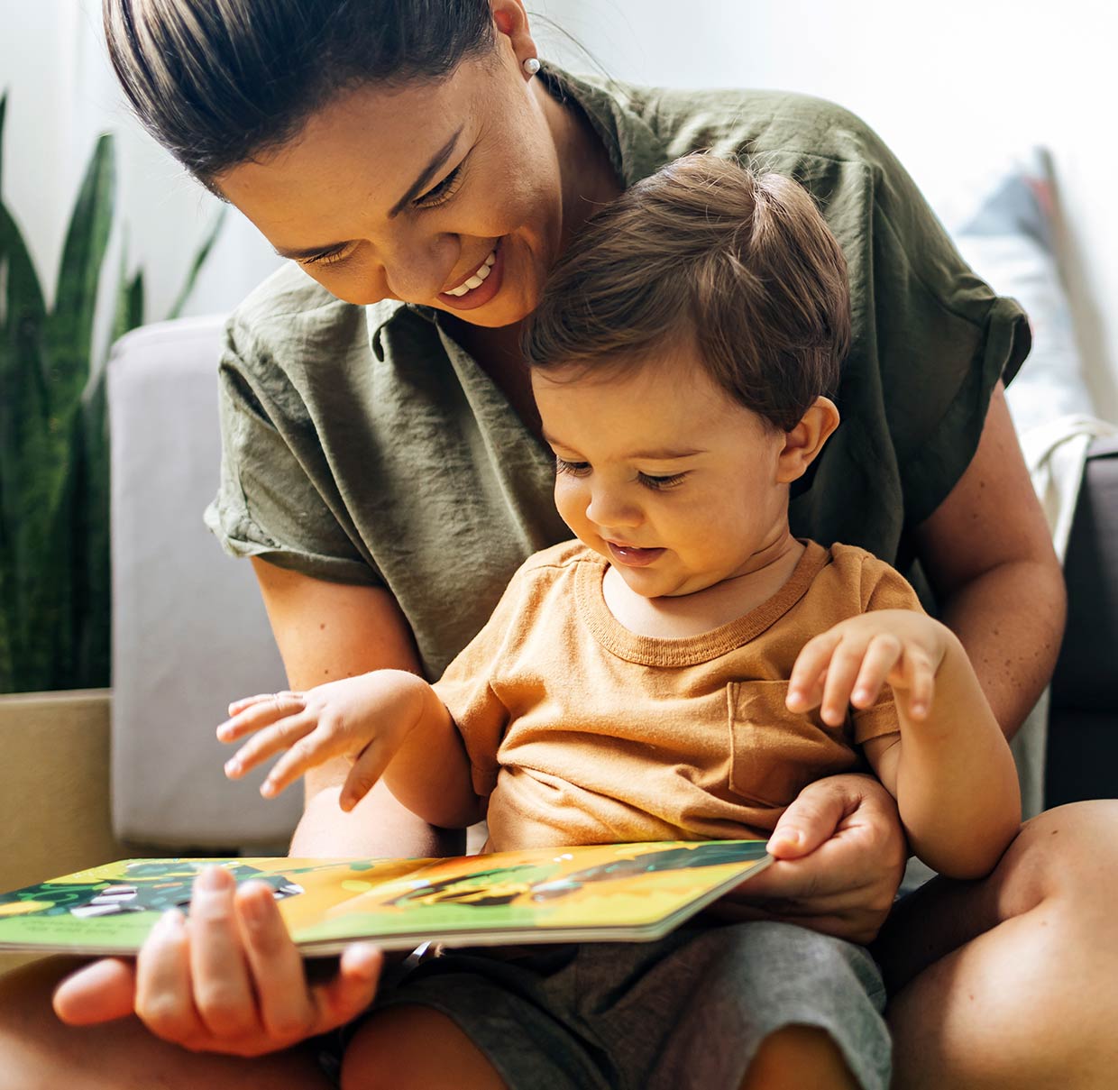 Mother reading book to child  image