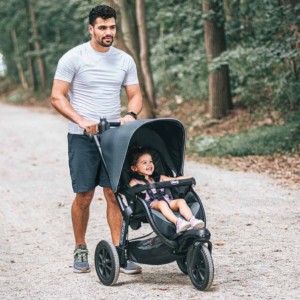 Father and baby with jogging stroller